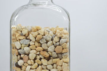 bottle with decorative stones close up