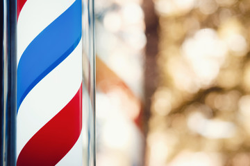 Barber shop pole on the window. copyspace