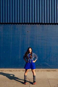Girl on roller skates with her hands on her hips