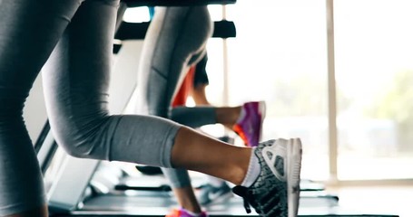 Group of friends exercising on treadmill machine - Powered by Adobe