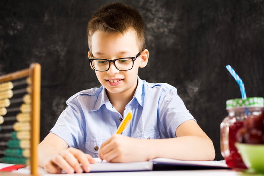 Boy doing math homework at home