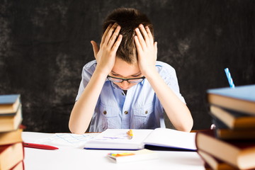 Boy having problems in finishing homework