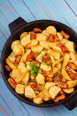 Pan-fried potato and meat. View from above, top studio shot