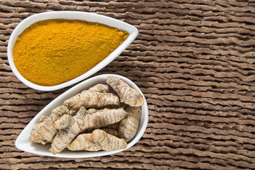 Roots and turmeric powder - Curcuma longa