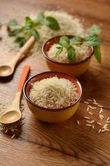 Raw basmati rice in terracotta bowl