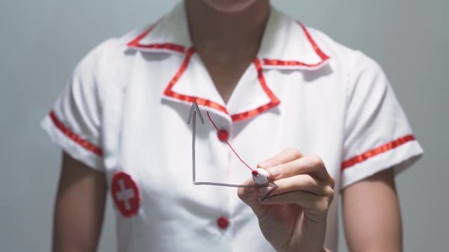 Woman doctor drawing decrease diagram with red down arrow on transparent screen.