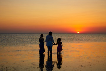 Happy family. Mother, youngest daughter and an seventeen-year-old daughter with Down syndrome.