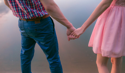 Young couple in love, Attractive man and woman enjoying romantic evening on the beach