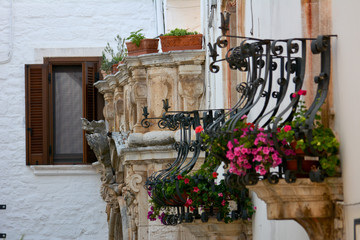 Fototapeta na wymiar italian flowered balconies