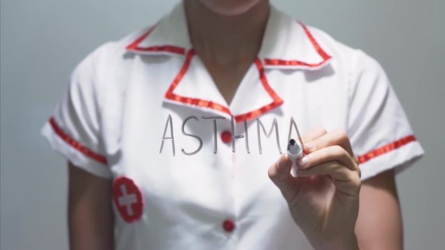 ASTHMA, Female doctor writing on transparent screen