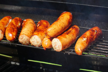 grilled sausage in a row for barbecue party
