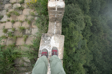 successful hiker legs on the top of great wall