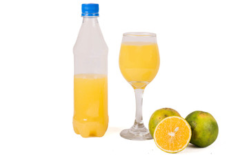 Orange juice in glass and a bottle.