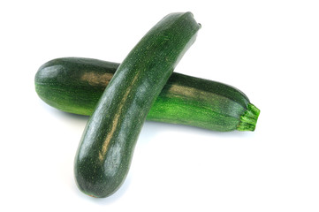 fresh green zucchini isolated on white background