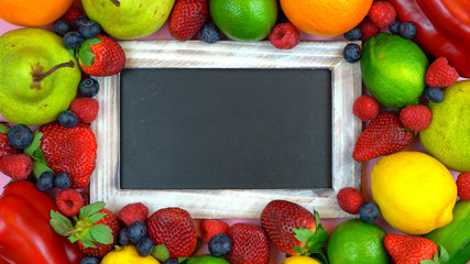 Fototapeta na wymiar Blackboard surrounded by healthy food,
