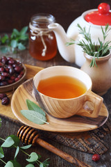 Healthy herbal tea with medicinal herbs, dog rose and honey