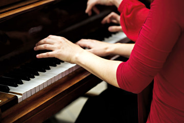 Fototapeta premium Closeup of female hands playing Argentine tango music