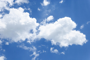 Blue sky with soft white clouds