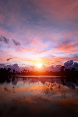 Fototapeta na wymiar Sunset sky with color cloud on the lake.