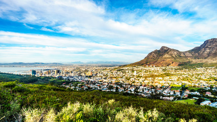 Sun setting over Table Mountain, Devils Peak and Cape Town. Viewed from the road to Signal Hill at Cape Town, South Africa