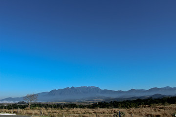 A beautiful blue sky over the mountain and the countryside