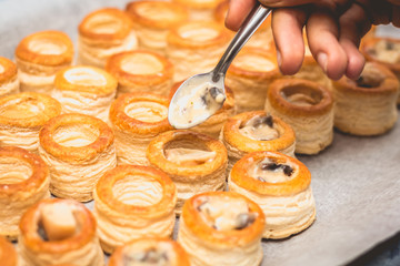 cook prepares minis french Puff Pastry Shell
