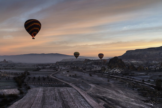 Balloons flying on a great view of Goreme, Goreme, Cappadocia, Turkey