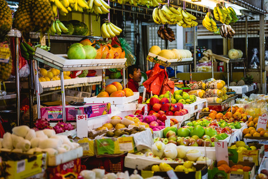 A colorful market stall full of fruits