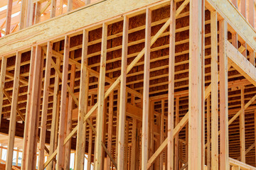 wood framework of new residential home under construction.