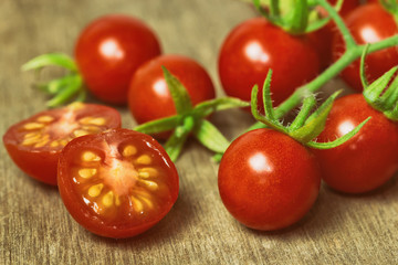 Fresh cherry tomato on rustic wood table. Close up lovely cherry tomato for background or...