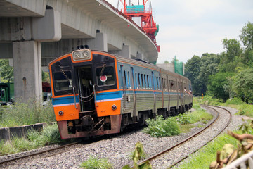 Obraz premium Train running on rails in Thailand, metal railway of train parallel with railway of Electric train.