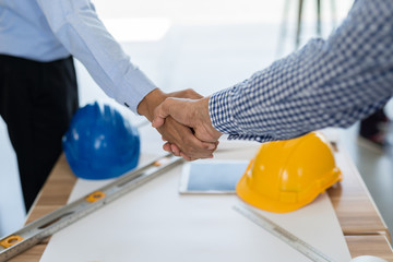 Businessmen handshake for make agreement in contract of Business Construction, Business concept.