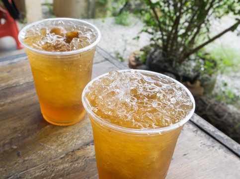 Closeup ice of longan drink on wood table