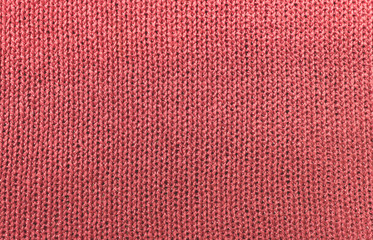 Texture of pink acrylic knitted fabric