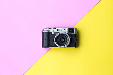 Flat lay vintage camera  on pastel background