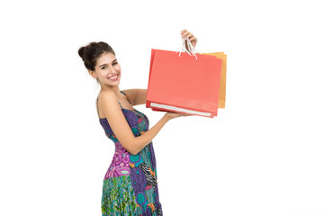 Young beautiful woman  holding shopping bags over white background