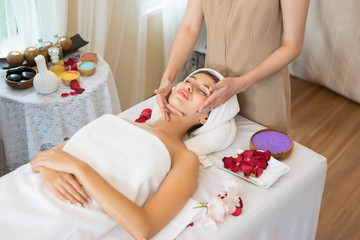 Obraz na płótnie Canvas Traditional oriental massage therapy and beauty treatments. Young beautiful have massage woman in spa salon.