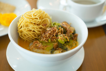Curried Noodle Soup (Khao soi) with spicy coconut milk