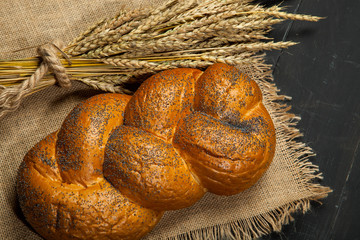 fresh bread and wheat on the wooden