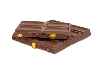 Pieces of the milk chocolate on a white background