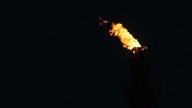 Slow Motion Tower Burning Torch on Gas Company Territory