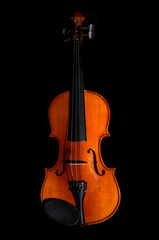Obraz na płótnie Canvas Violin orchestra musical instruments on black background
