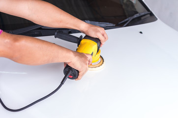 Polishing the white car with reflection, car care concept