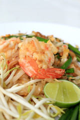 Thai food Pad Thai ,Stir fry noodles with shrimp in white plate. The one of Thailand's national main dish. the popular food in Thailand. Thai Fried Noodles.