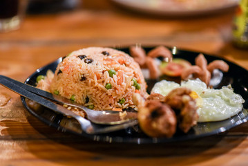 Fried rice with fried egg and fried chicken