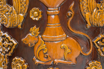 rat wood carving on wall