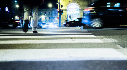 People walking on the street at night in Turin Italy