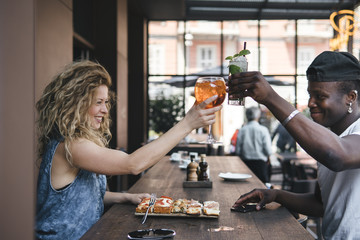 mixed race couple together in a restaurant