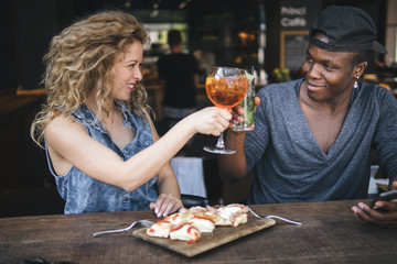 mixed race couple together in a restaurant