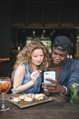 mixed race couple together in a restaurant